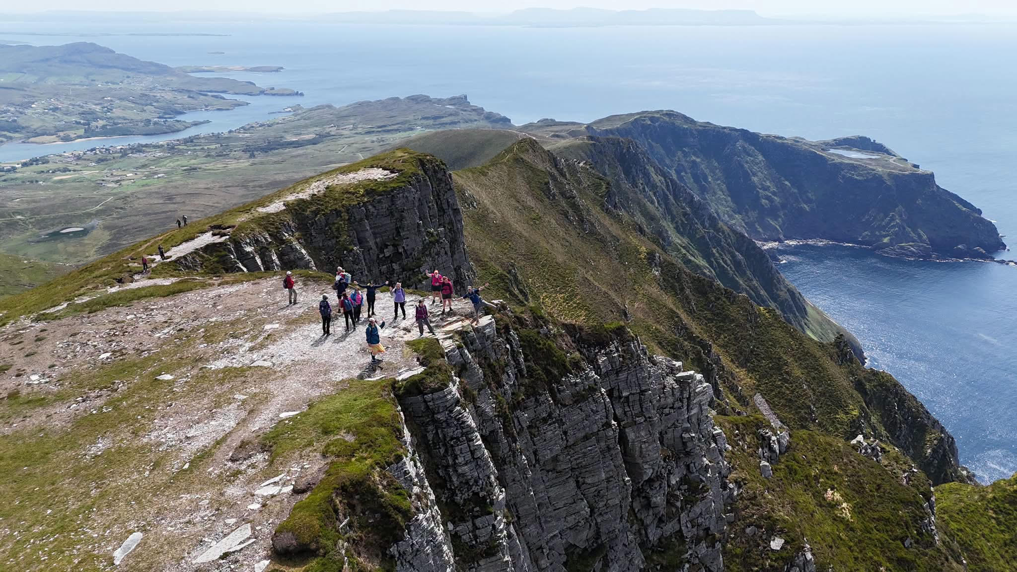 Landscape and walkers on the Slieve League with Pilgrim's Path route in Donegal.